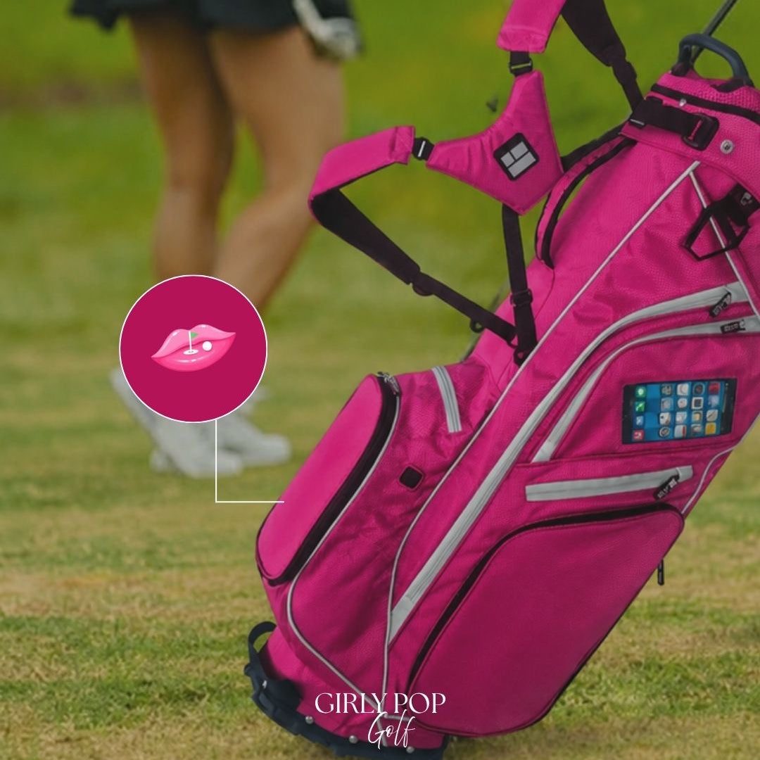 The hot pink stand bag standing on the fairway as a member walks past.